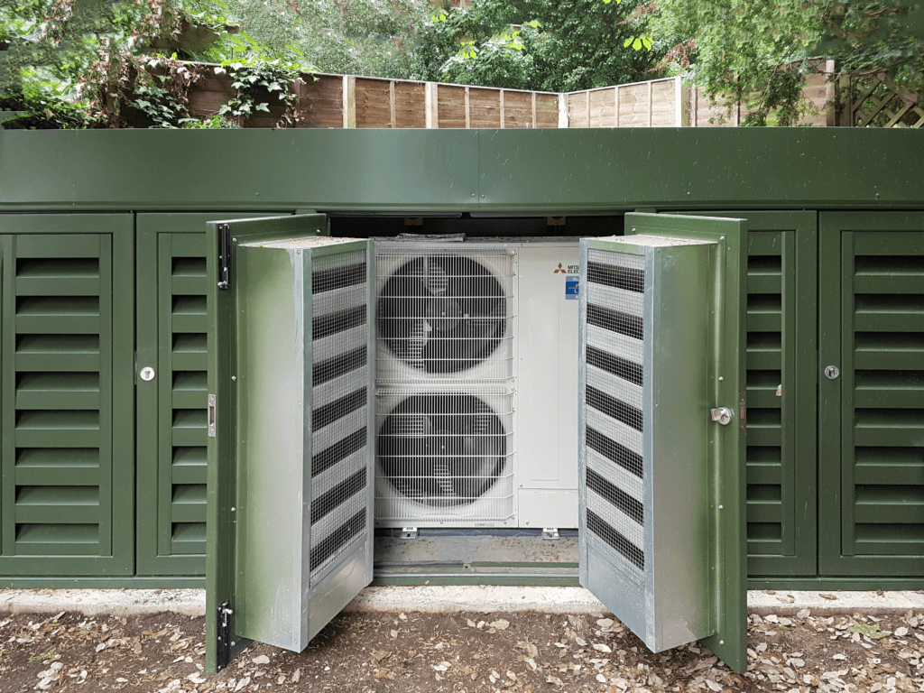 External condenser acoustic enclosure in garden