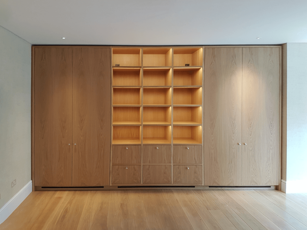 Bespoke joinery in a Holland Park mansion concealing air conditioning equipment, with joinery slots and a shadow gap detail providing supply and return air paths