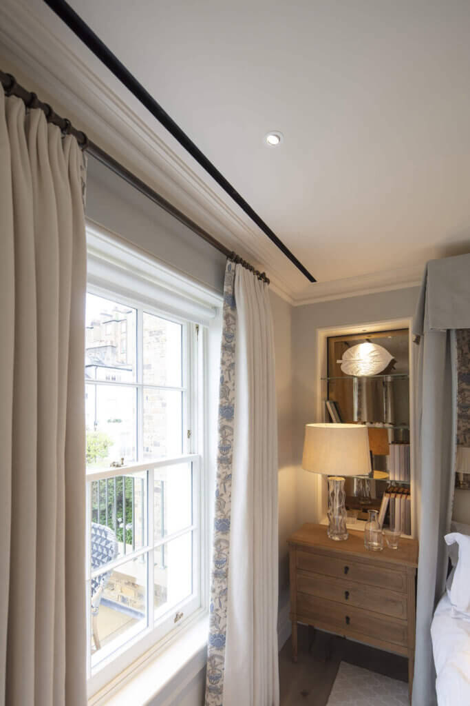 Single slot diffuser for air conditioning in a Kensington bedroom