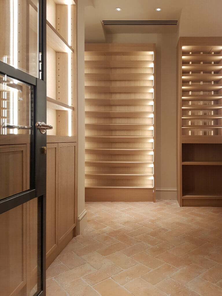 Discreet plaster-in triple slot diffuser for wine cellar air conditioning in a luxury London residence