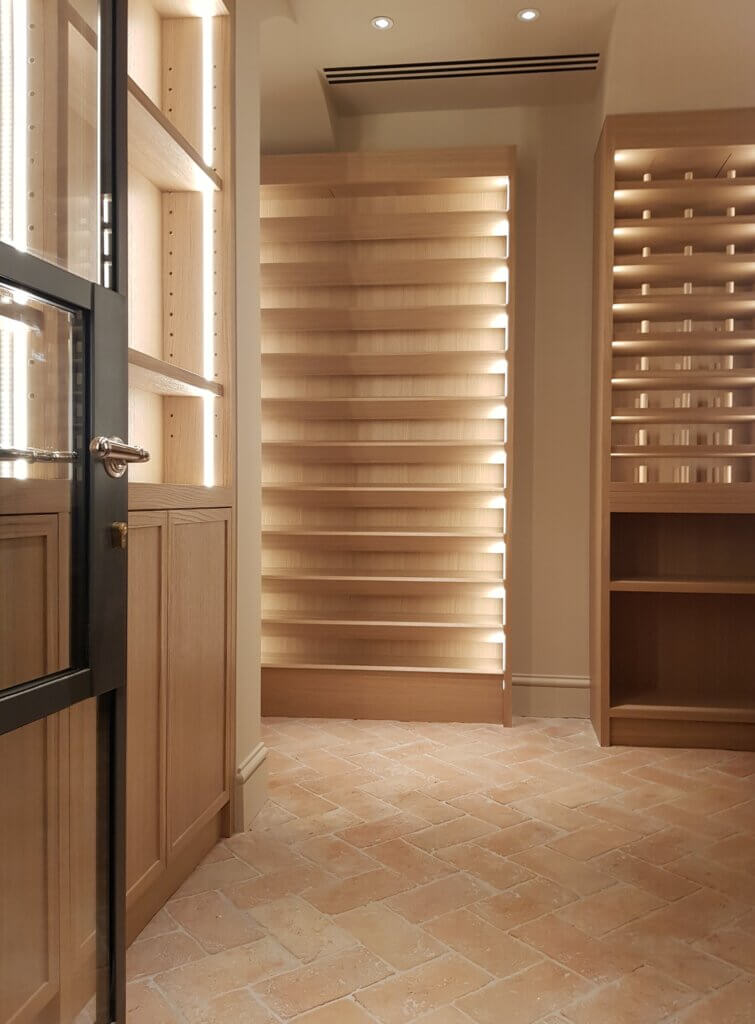 Triple slot diffusers in the ceiling for wine cellar ventilation in a luxury Kensington townhouse