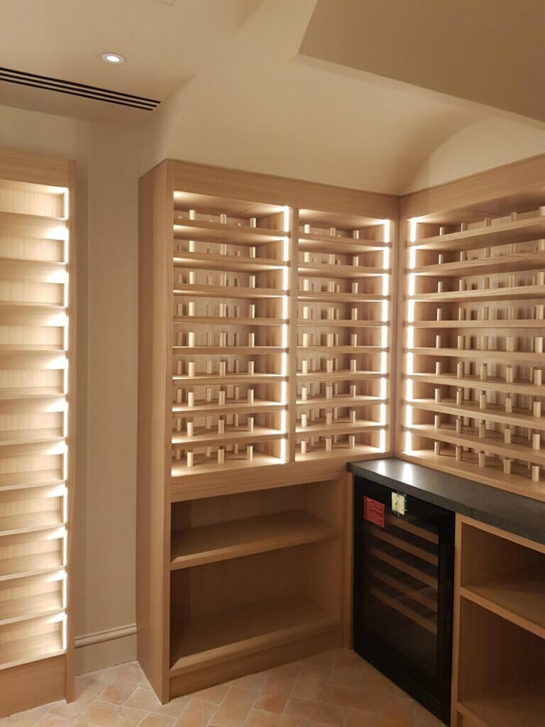 Triple slot diffusers in the ceiling for wine cellar ventilation in a luxury Kensington townhouse