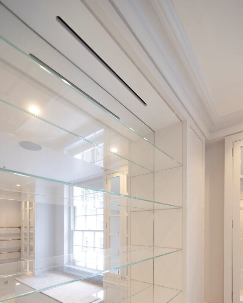 Discreet slot in joinery for ventilation to the bathroom in a luxury Kensington residence