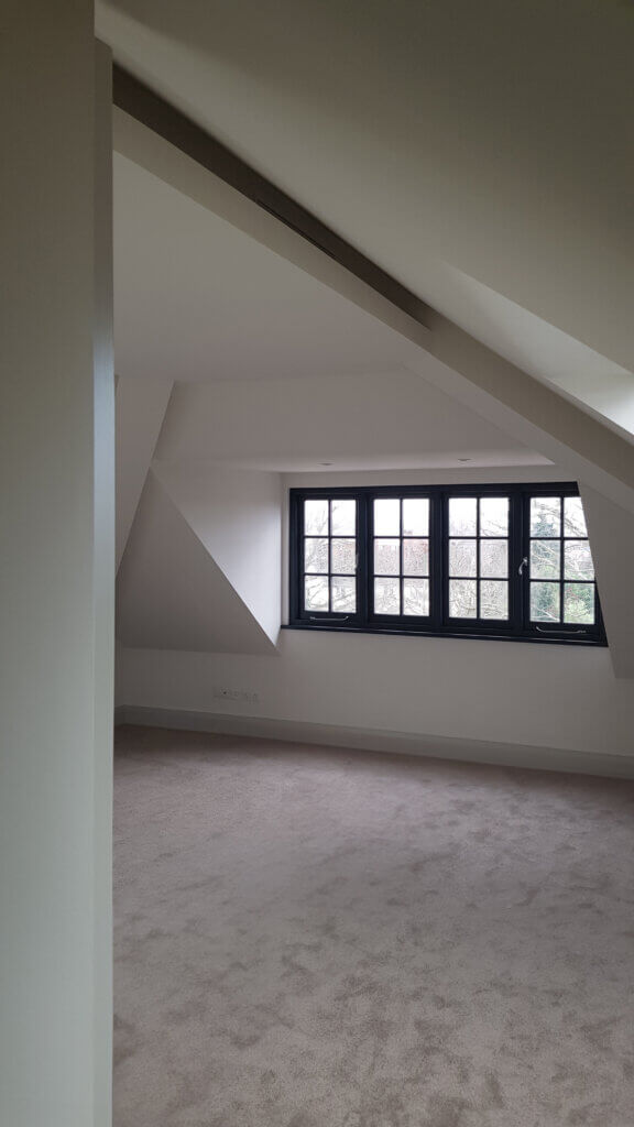 Diffusers concealed within the ceiling detail in a luxury new build property in the Arts and Crafts style in Wimbledon
