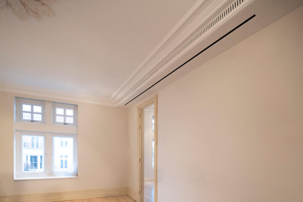 Concealed ducted air conditioning integrated into cornice detailing