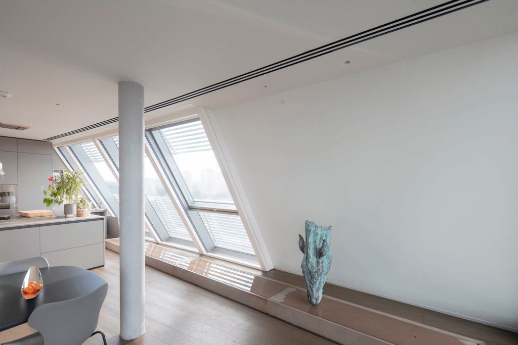 Triple slot diffusers in the ceiling for ventilation and air conditioning to a luxury Battersea penthouse overlooking the Thames