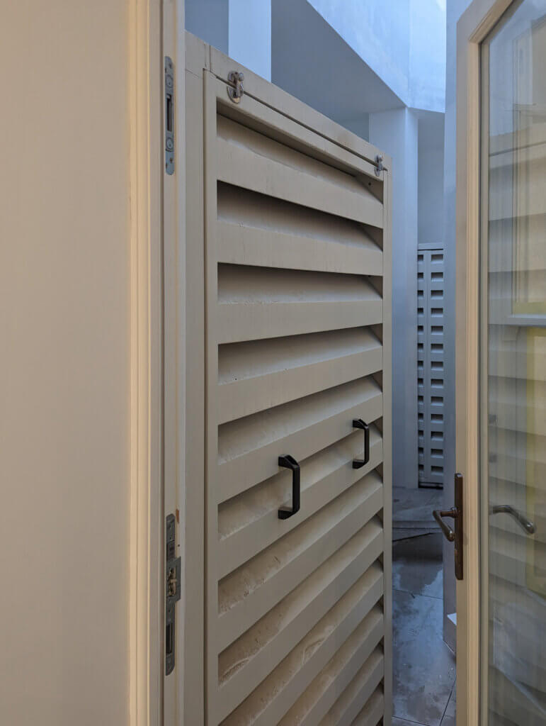 External acoustic enclosures for silent air conditioning concealed in the lightwell in a London conservation area