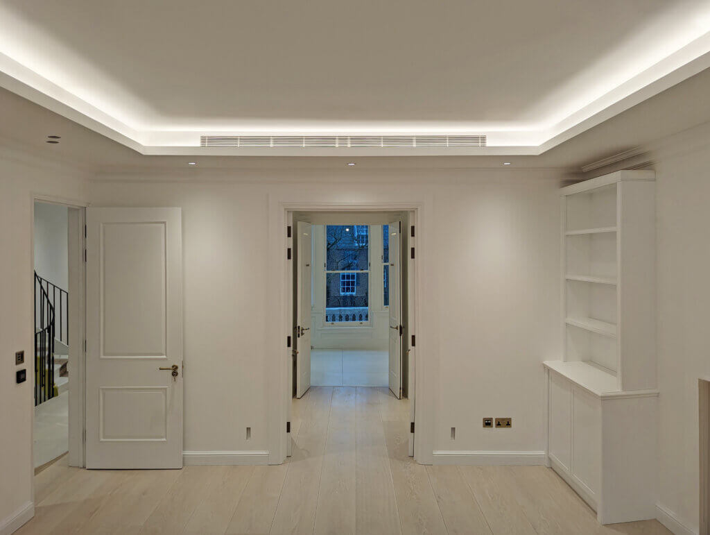 Linear bar grille concealed within the coffered ceiling detail for invisible air conditioning to a luxury four storey mansion refurbishment in Kensington