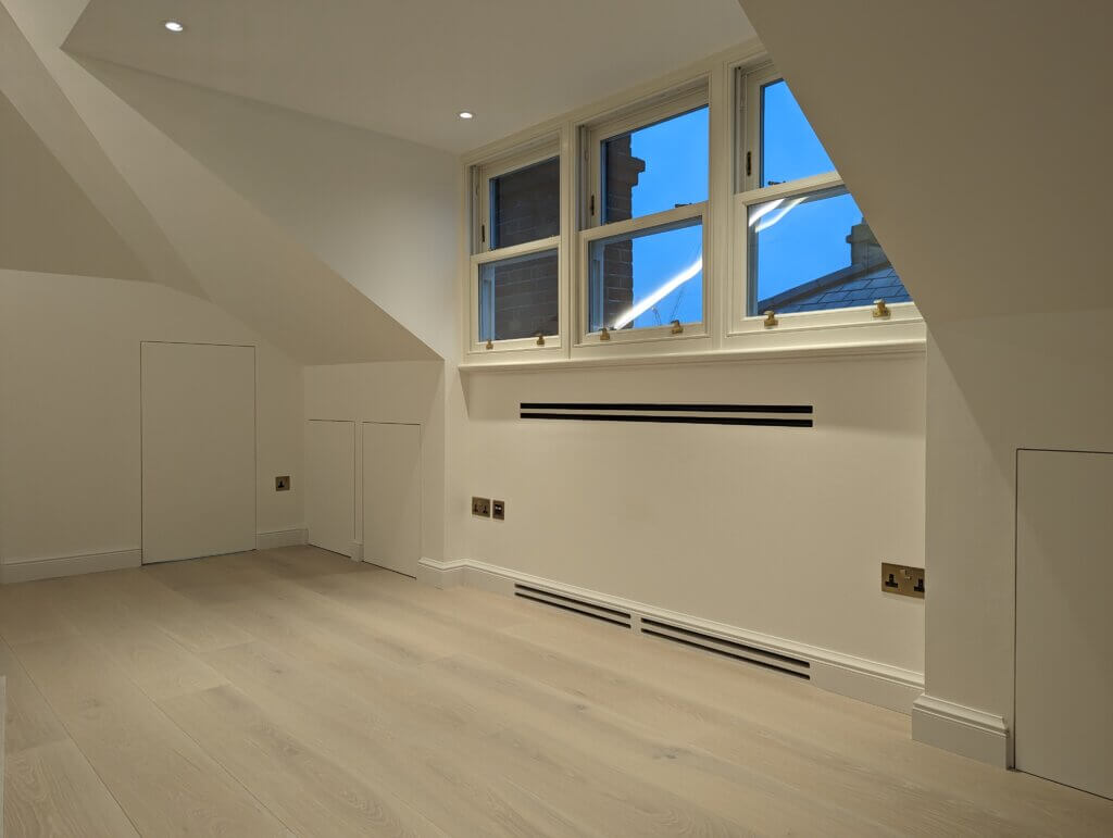 Access panels for discreet air conditioning with units hidden in the eaves void