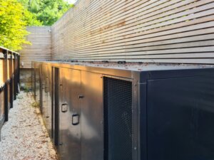 External acoustic enclosures for silent air conditioning concealed behind a secondary fence in a London conservation area