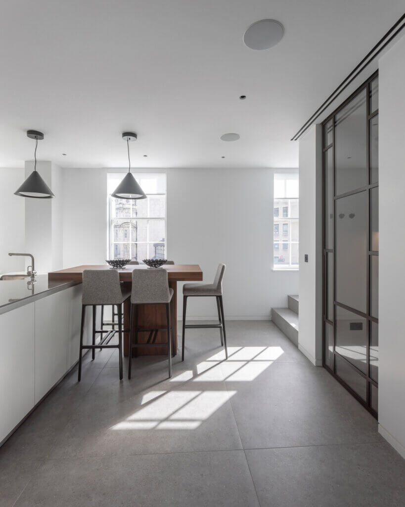 Twin slot diffusers above a crittall doorway in a luxury lateral apartment kitchen overlooking Regent's Park
