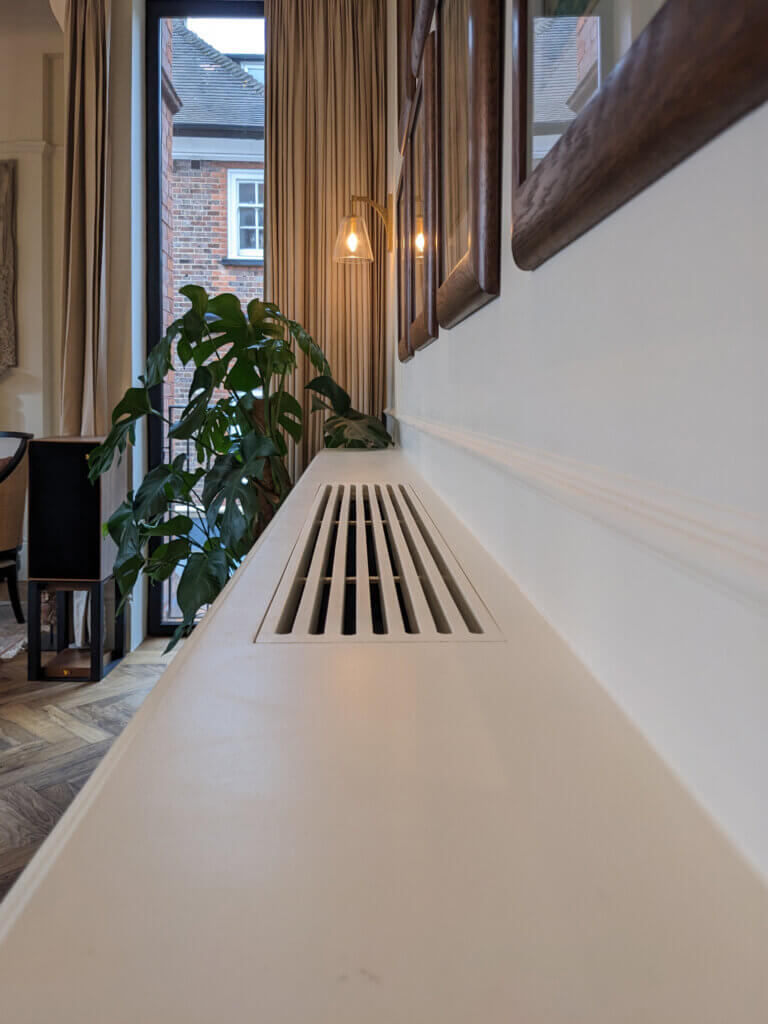 Joinery slots and access to air conditioning equipment in a luxury townhouse in Hampstead