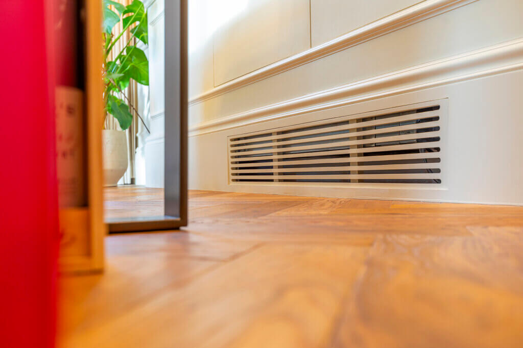Joinery slots and access to air conditioning equipment in a luxury townhouse in Hampstead