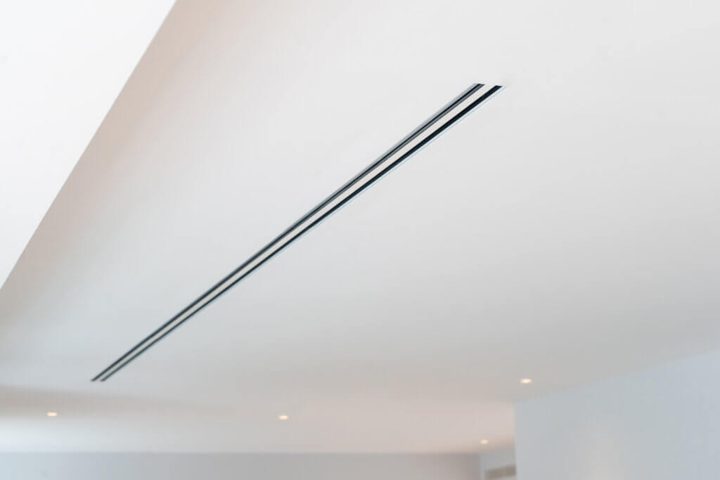 ceiling slots for integrated air conditioning in a luxury Kensington townhouse